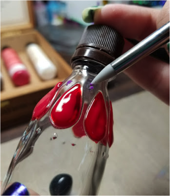 Freebie syrup bottle being decorated by Alison Heikkila with StazOn Studio Glaze and a Doodlesdtix.