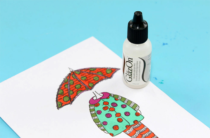 A multi-colored image by Jowilna Nolte with a bottle of GlazOn.