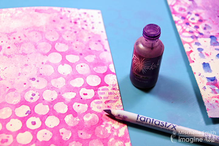 Open Fireworks bottle next to and inked paper and inked Fantastix applicator.