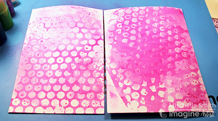 Watercolor paper with different layers of pink Fireworks ink.