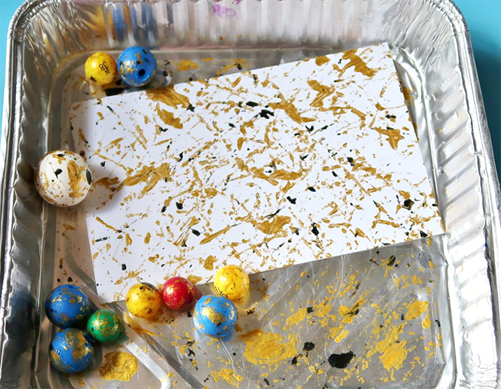Marbles mark carstock with ink drops for Delicata inkers in a disposable tray.