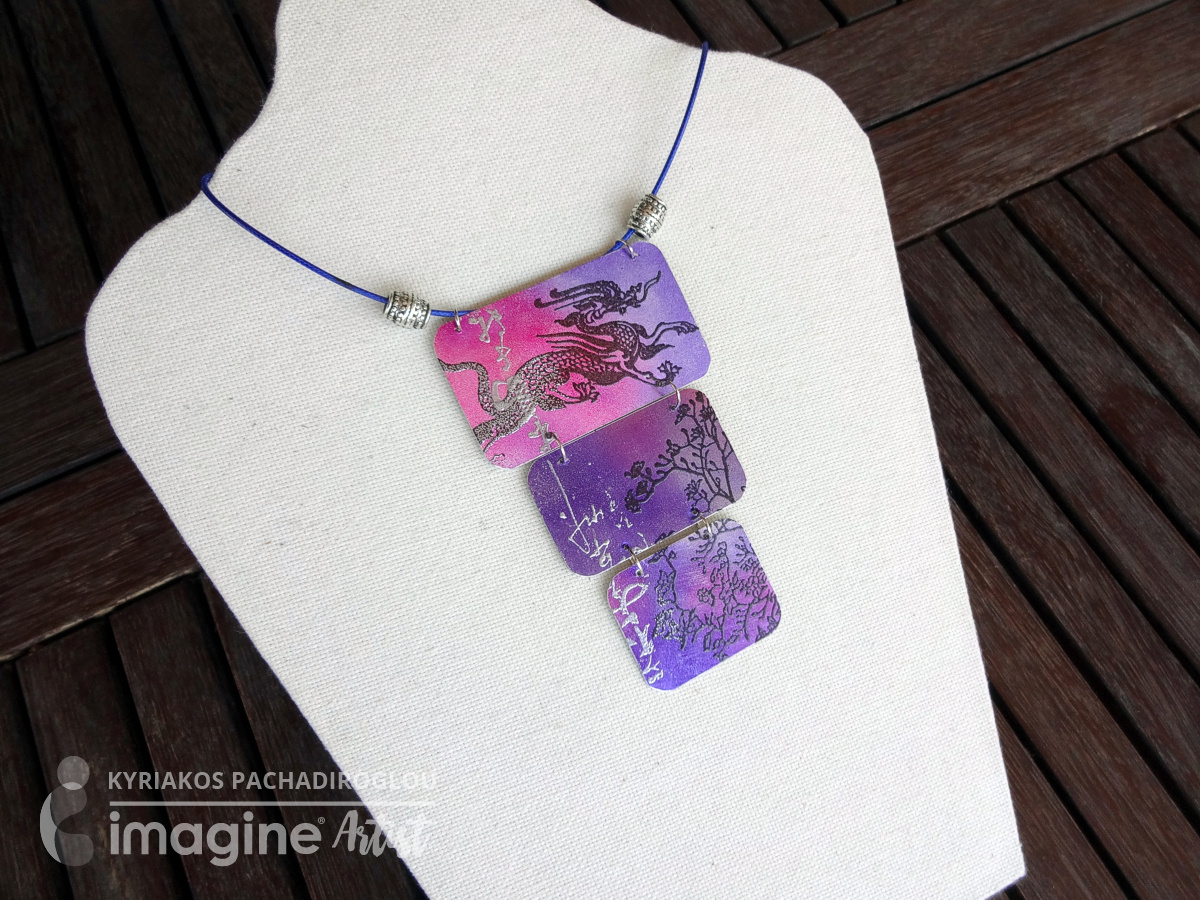 Dragon themed necklace made by Kyriakos of The Crafters World using Imagine's Sheet Metal and Tsukineko's StazOn inks in Royal Purple and Blazing Red.