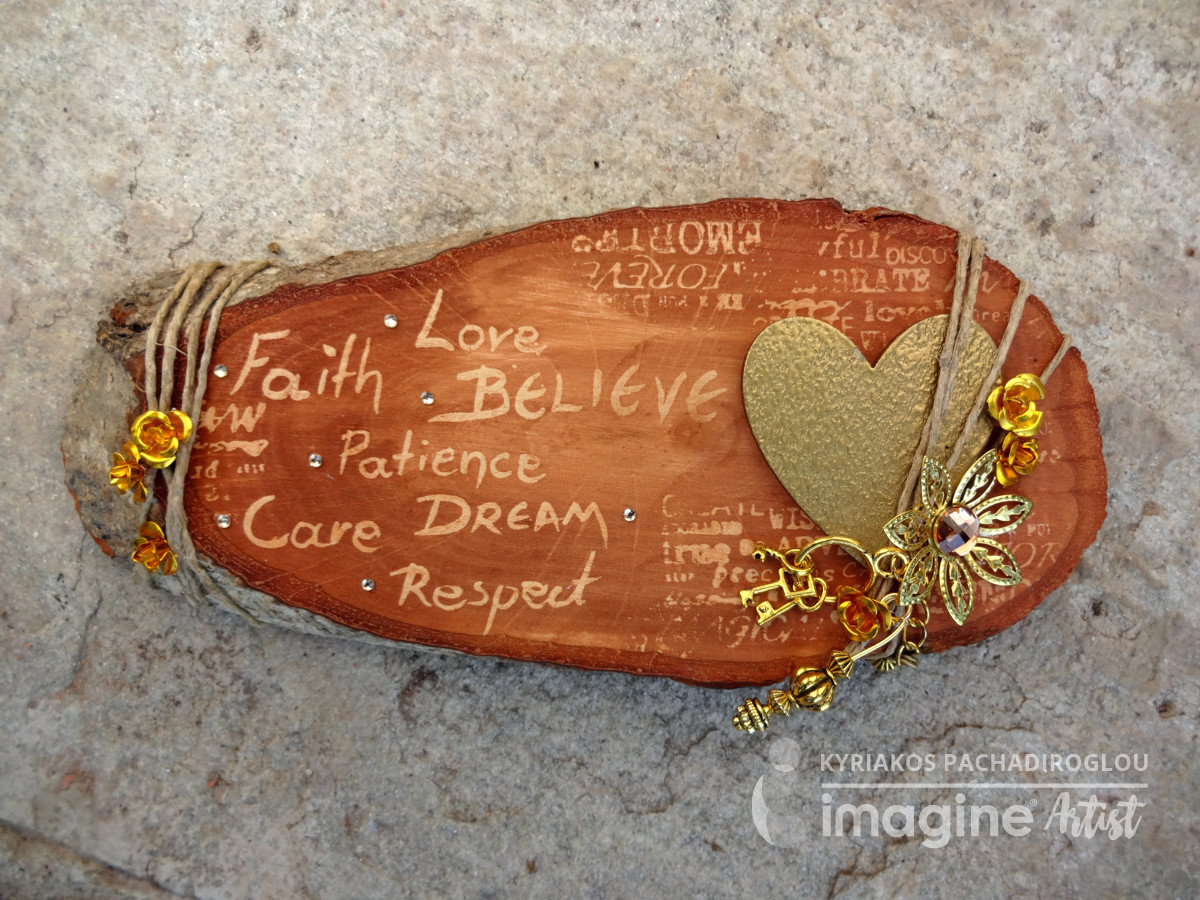 A decorated rustic wood round with mulitple encouragements appearing as a resist from using GooseBumps before staining with Walnut Ink by Kyriakos of The Crafts World.