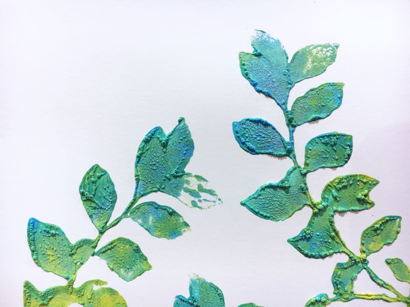 Leafy design stamped with Amplify and puffed with a heat tool in electric blue, electric green and electric yellow.