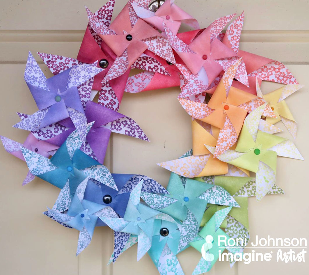 Rainbow paper door wreath handmade using cardstock and VersaMagic ink in 21 colors.