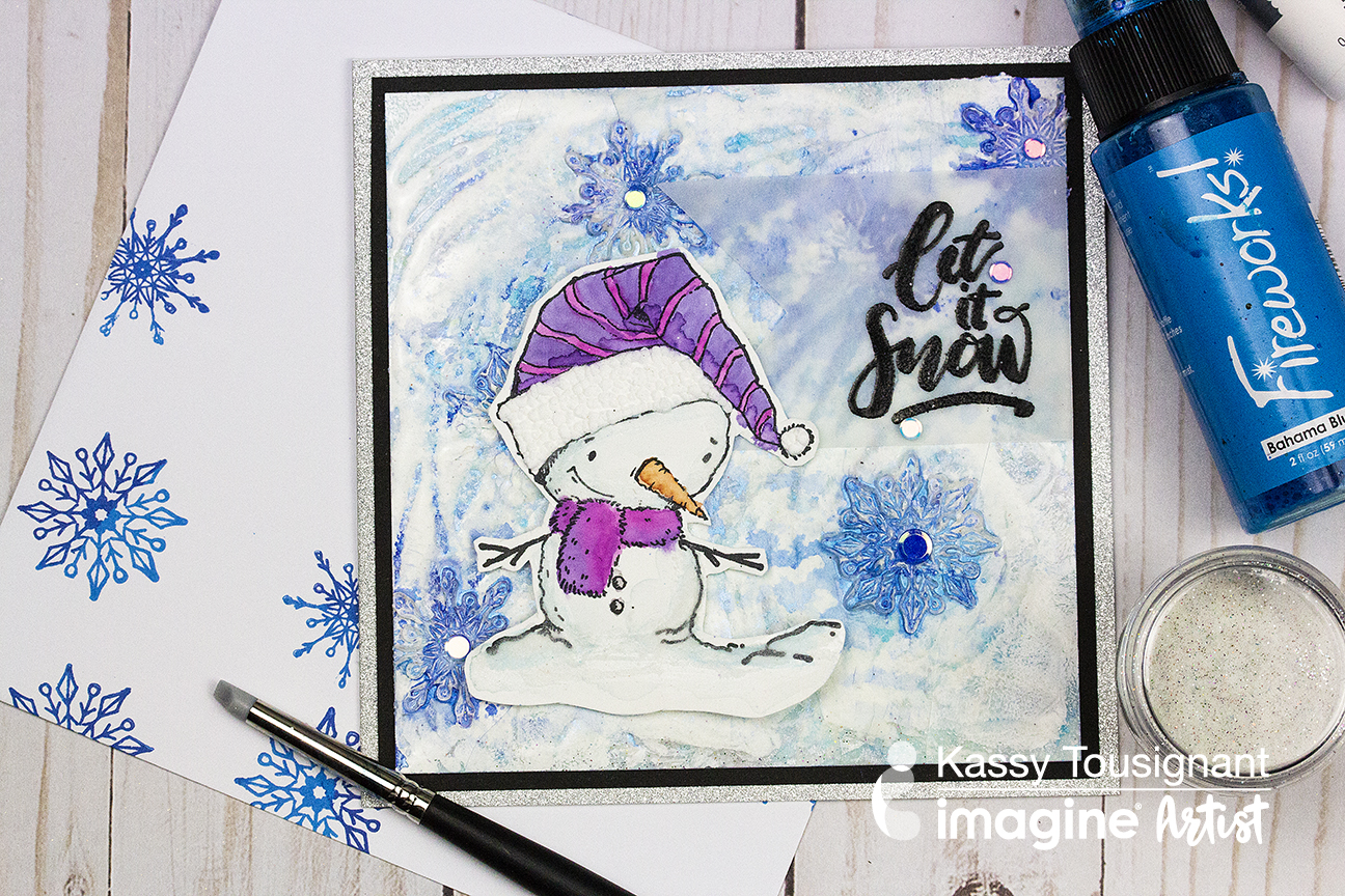 Handmade holiday card with a snowy background and snowman image