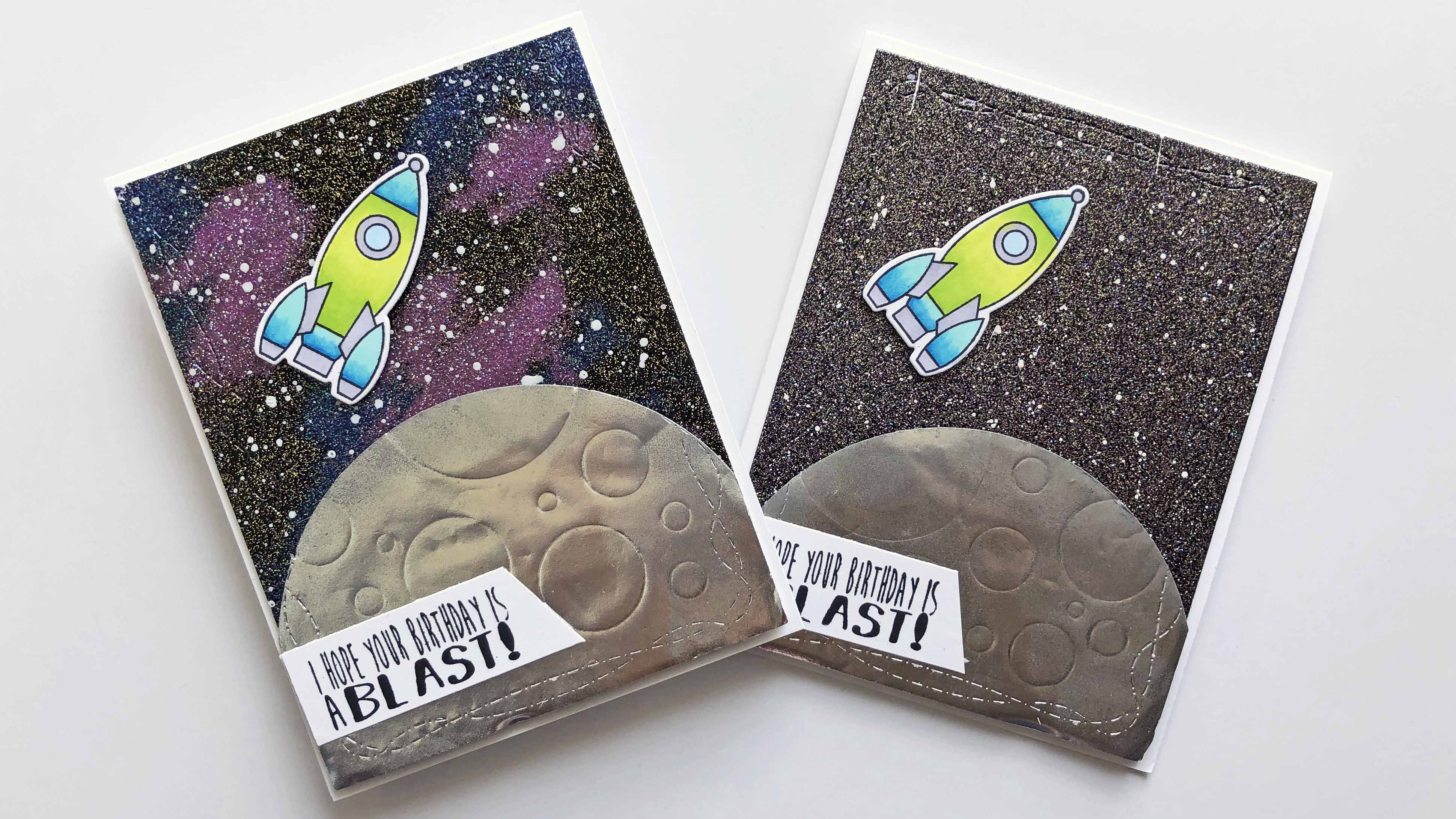Two handmade space themed cards made using embossing powders to create two different galaxy looks